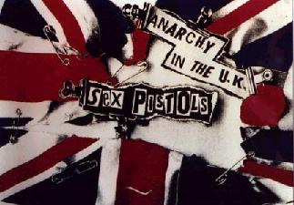 [Cover art from the Sex Pistols single "Anarchy in the UK" featured a torn-apart Union Jack held together with safety pins and decorated with cut-out, ransom-letter-esque text.]